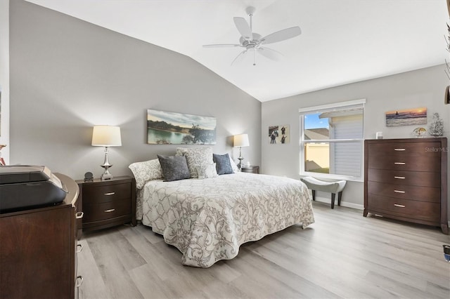 bedroom featuring ceiling fan, lofted ceiling, and light hardwood / wood-style floors