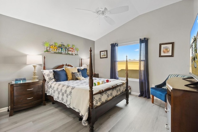 bedroom featuring ceiling fan, lofted ceiling, and light hardwood / wood-style floors