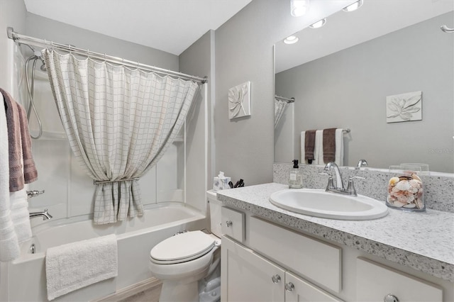 full bathroom featuring toilet, vanity, and shower / tub combo