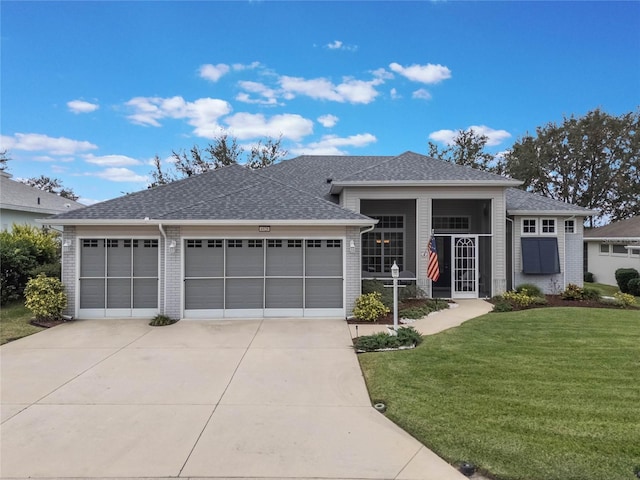 view of front of home featuring a front lawn and a garage