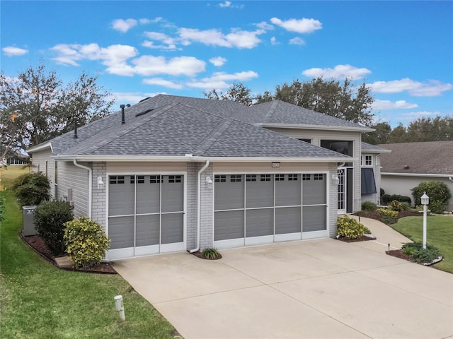 exterior space with a front yard and a garage