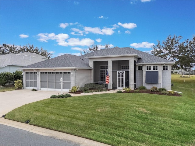 prairie-style home with a front yard and a garage