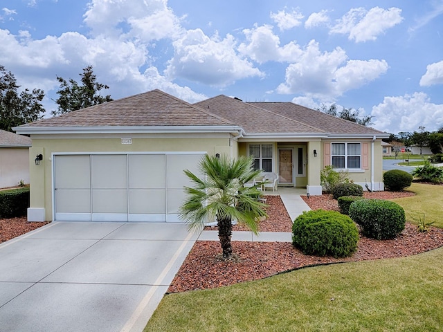 ranch-style home with a front yard and a garage