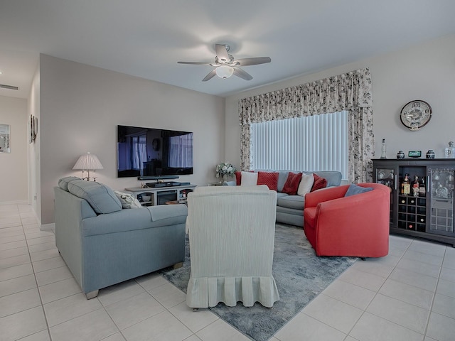 tiled living room with ceiling fan