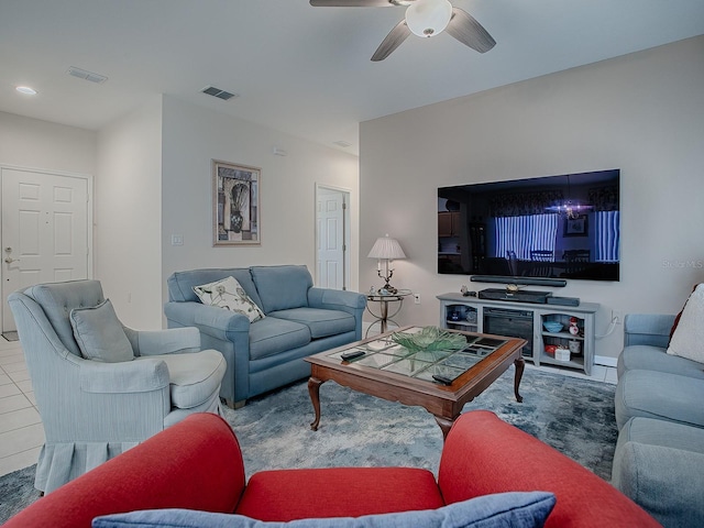 living room featuring ceiling fan and light tile patterned floors