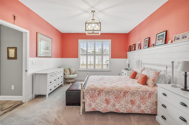 bedroom featuring light carpet