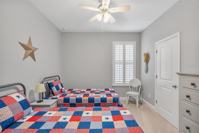 bedroom featuring ceiling fan and light carpet