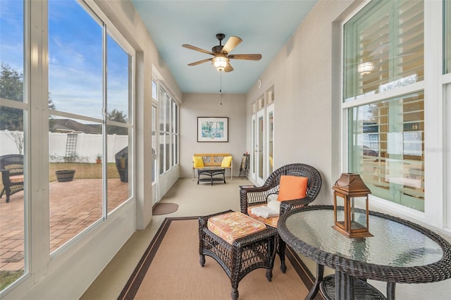 sunroom / solarium with ceiling fan and plenty of natural light