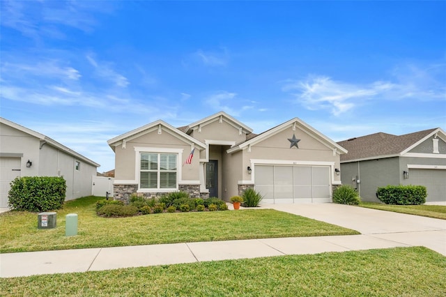 view of front of property with a garage and a front lawn