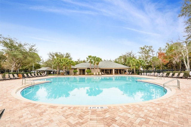 view of swimming pool with a patio area