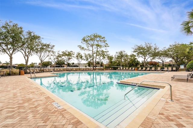 view of swimming pool with a patio