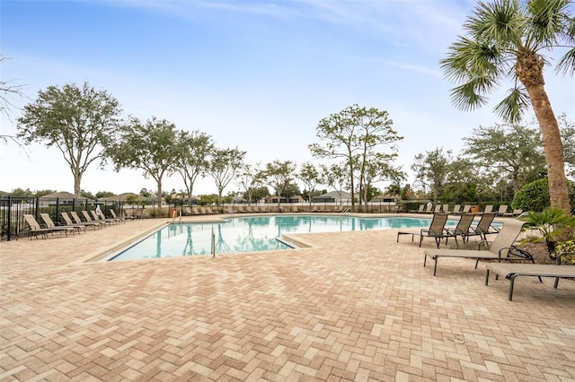 view of swimming pool with a patio area