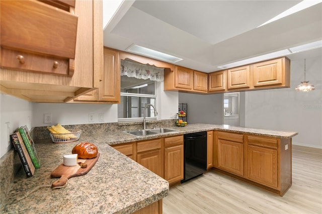 kitchen with a sink, light wood-type flooring, a peninsula, and dishwasher