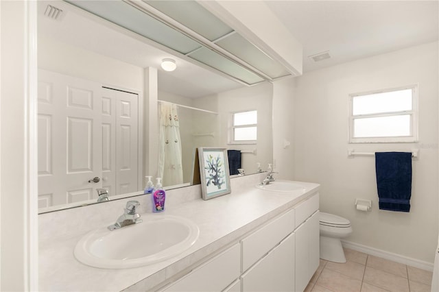 full bathroom with toilet, visible vents, and a sink