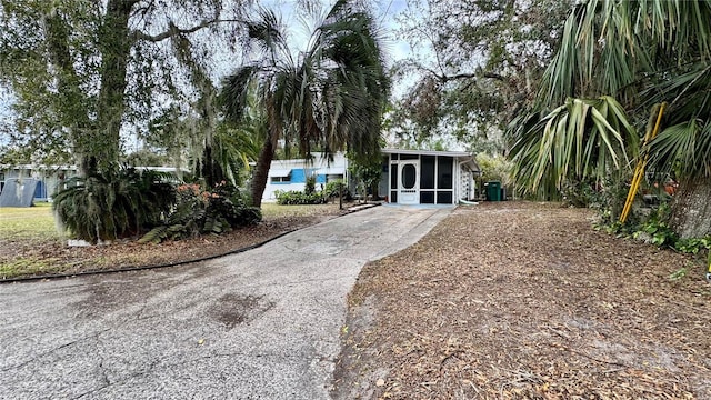 view of front of home with a sunroom