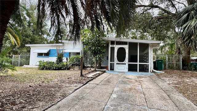 exterior space featuring a sunroom