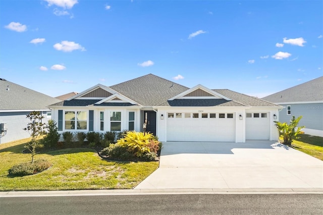 view of front of house with a garage and a front lawn