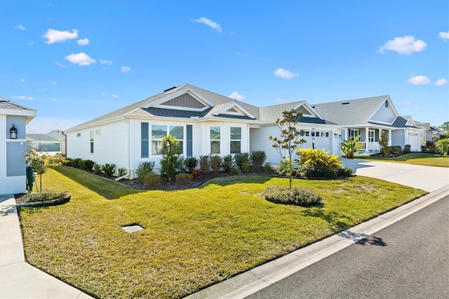 ranch-style home featuring a garage and a front yard