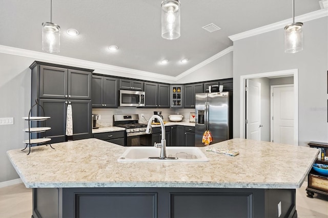 kitchen featuring hanging light fixtures, appliances with stainless steel finishes, and a large island