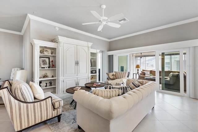 living room featuring ceiling fan, light tile patterned floors, and crown molding