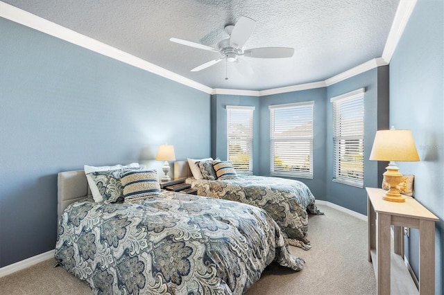 carpeted bedroom featuring a textured ceiling, ceiling fan, and crown molding