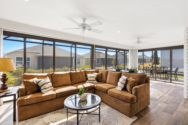 sunroom with ceiling fan and a wealth of natural light