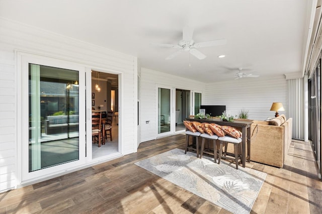 sunroom / solarium with ceiling fan