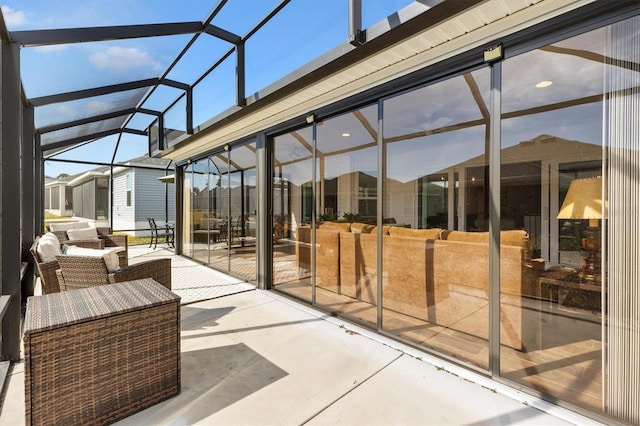 view of patio featuring a lanai