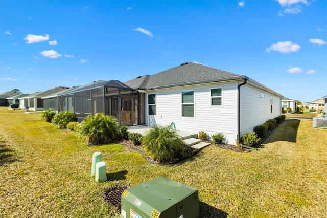 rear view of house with a yard