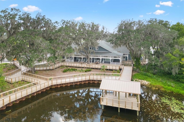 rear view of house with a water view