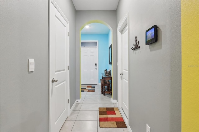 corridor with light tile patterned floors