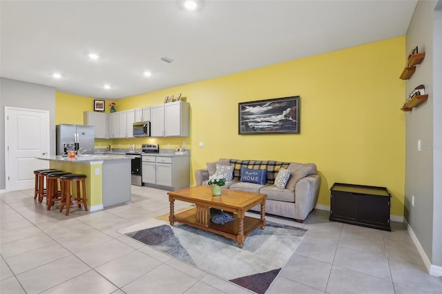 living room featuring light tile patterned flooring