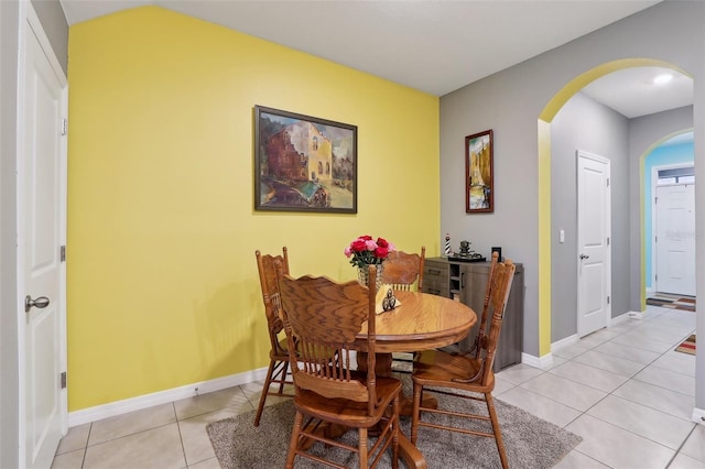 dining room with light tile patterned flooring