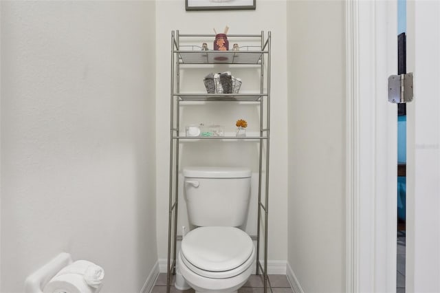 bathroom with tile patterned floors and toilet