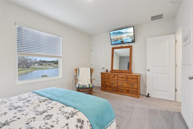 bedroom with light colored carpet