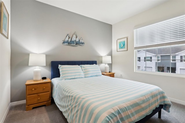 bedroom featuring dark carpet