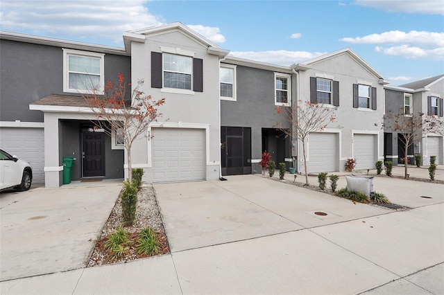 multi unit property featuring a garage