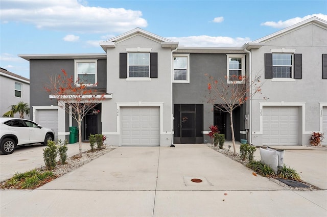 multi unit property featuring a garage