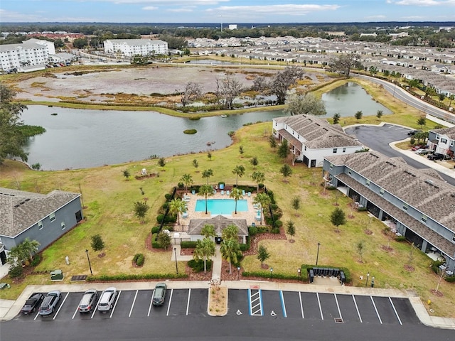 birds eye view of property with a water view