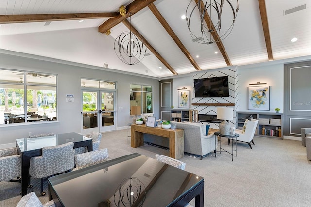 living room featuring light colored carpet, a fireplace, an inviting chandelier, high vaulted ceiling, and french doors