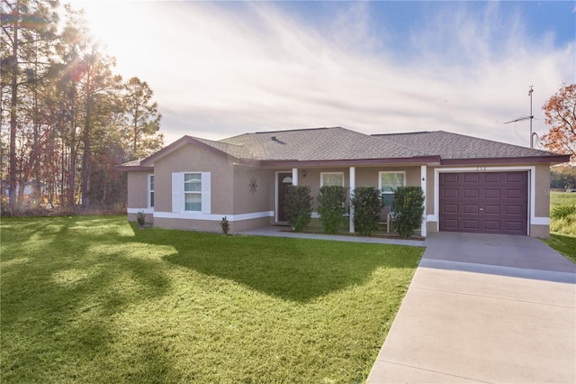 ranch-style home featuring a garage and a front yard