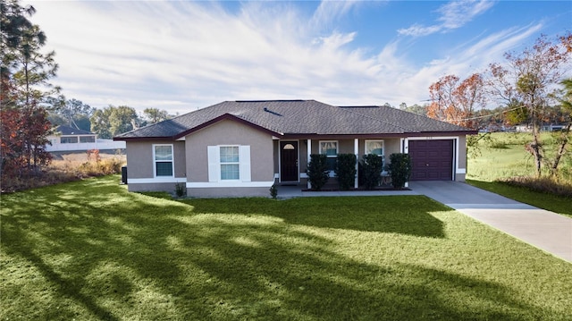 ranch-style home with a garage and a front lawn