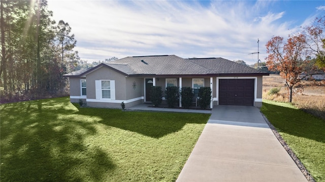 ranch-style house with a garage and a front yard