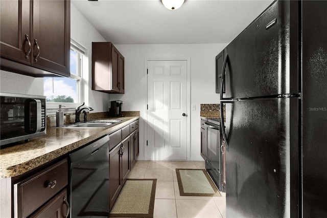 kitchen with sink, dark brown cabinets, black appliances, and light tile patterned flooring