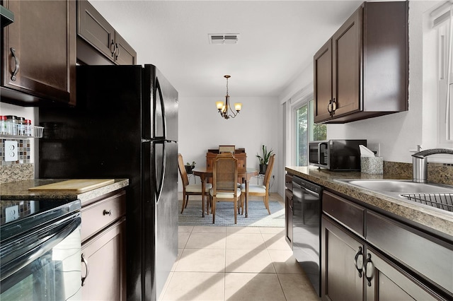 kitchen with light tile patterned flooring, sink, dark brown cabinets, and black appliances