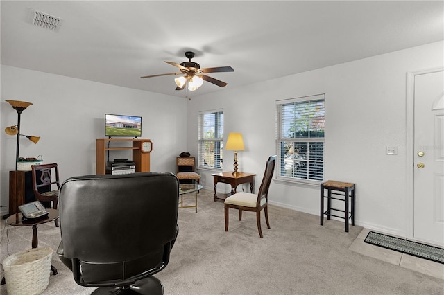 home office with light colored carpet and ceiling fan