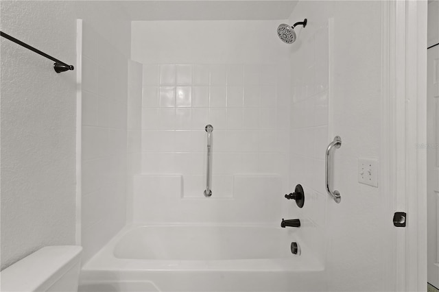 bathroom featuring toilet and shower / bathing tub combination