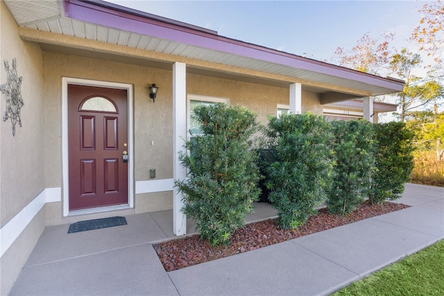 238 Oak Lane Cir, Ocala, FL 34472 - doorway to property featuring stucco siding