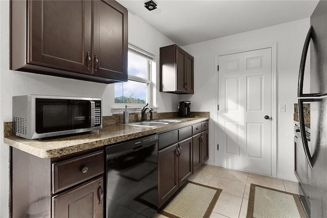 238 Oak Lane Cir, Ocala, FL 34472 - kitchen with black appliances, light tile patterned flooring, dark brown cabinets, and a sink