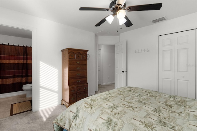 238 Oak Lane Cir, Ocala, FL 34472 - bedroom featuring visible vents, ensuite bath, a closet, light colored carpet, and ceiling fan